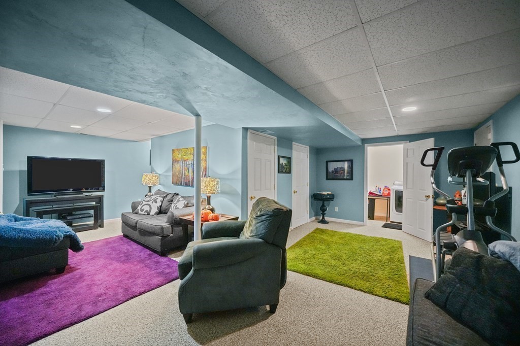 3 Carter Way Worcester, MA 01609 - Photo 23 of 32 a living room with furniture and a flat screen tv