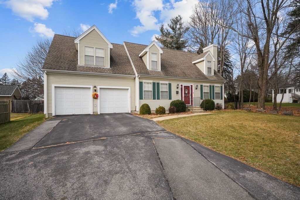 3 Carter Way Worcester, MA 01609 - Photo 26 of 32 a front view of a house with a yard and garage