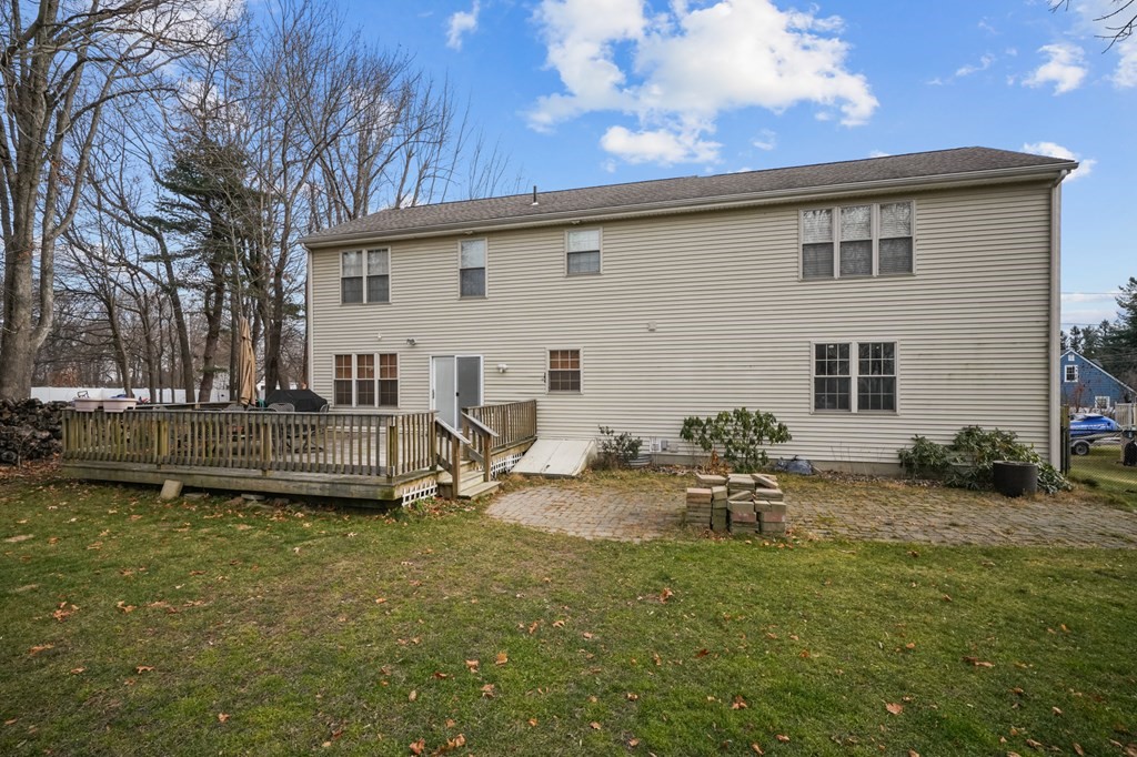 3 Carter Way Worcester, MA 01609 - Photo 32 of 32 a backyard of a house with table and chairs