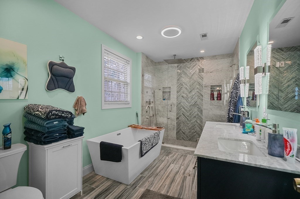 3 Carter Way Worcester, MA 01609 - Photo 5 of 32 a bathroom with a double vanity sink toilet and shower