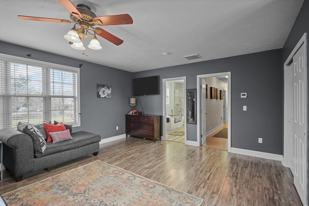 3 Carter Way Worcester, MA 01609 - Photo 7 of 32 a living room with furniture and a flat screen tv