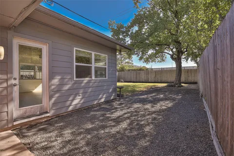 a view of a house with pool and a yard