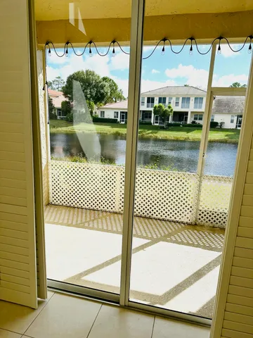a view of a lake with a house in the background