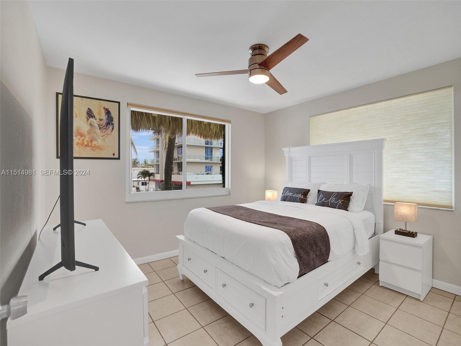 900 North Surf Road, Unit 2 Hollywood, FL 33019 - Photo 11 of 48 a bedroom with a bed and a window