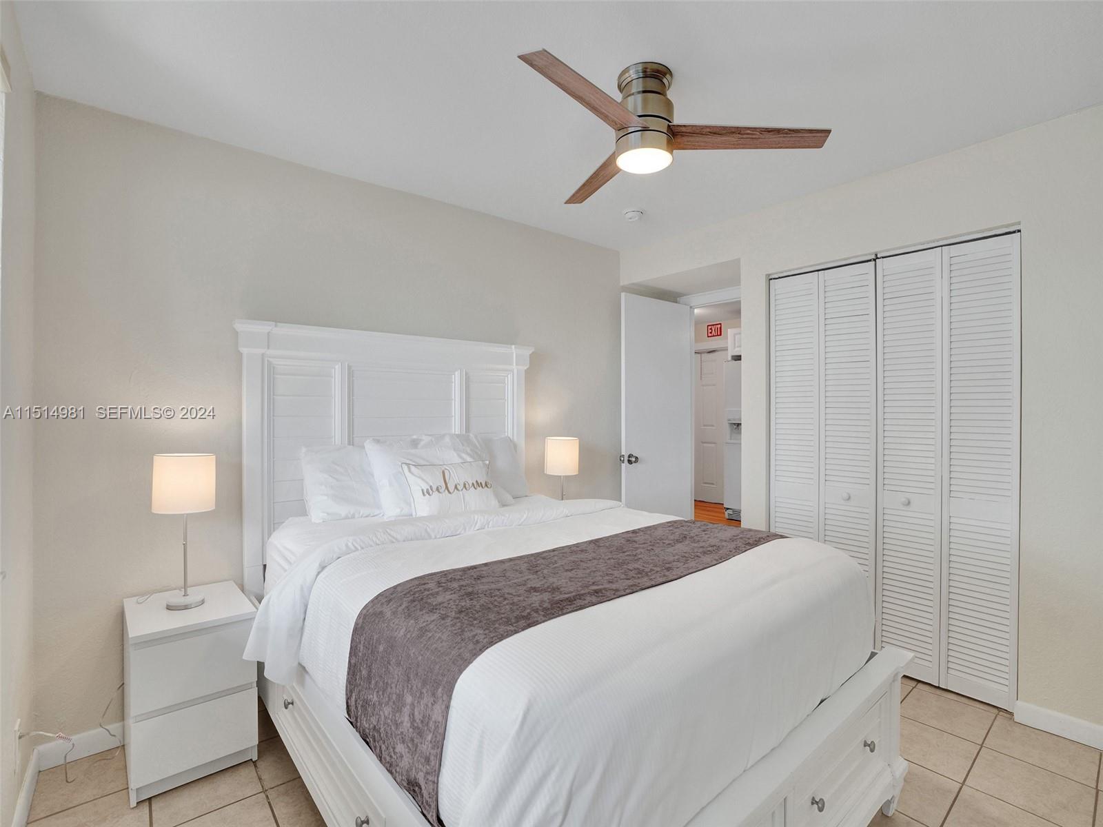 900 North Surf Road, Unit 2 Hollywood, FL 33019 - Photo 20 of 48 a bedroom with a bed and a table