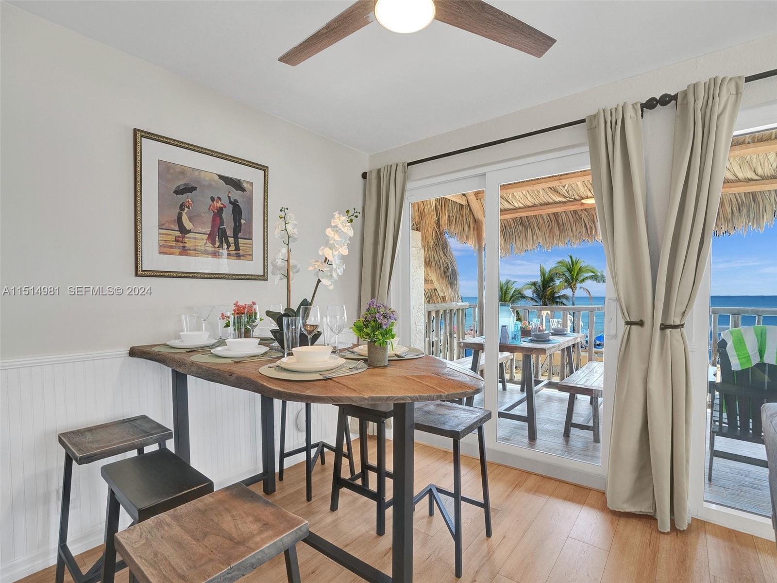 900 North Surf Road, Unit 2 Hollywood, FL 33019 - Photo 2 of 48 a view of a dining room with furniture window and wooden floor