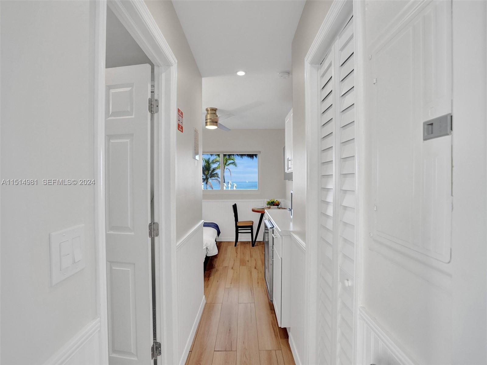 900 North Surf Road, Unit 2 Hollywood, FL 33019 - Photo 30 of 48 a view of a hallway with wooden floor and staircase