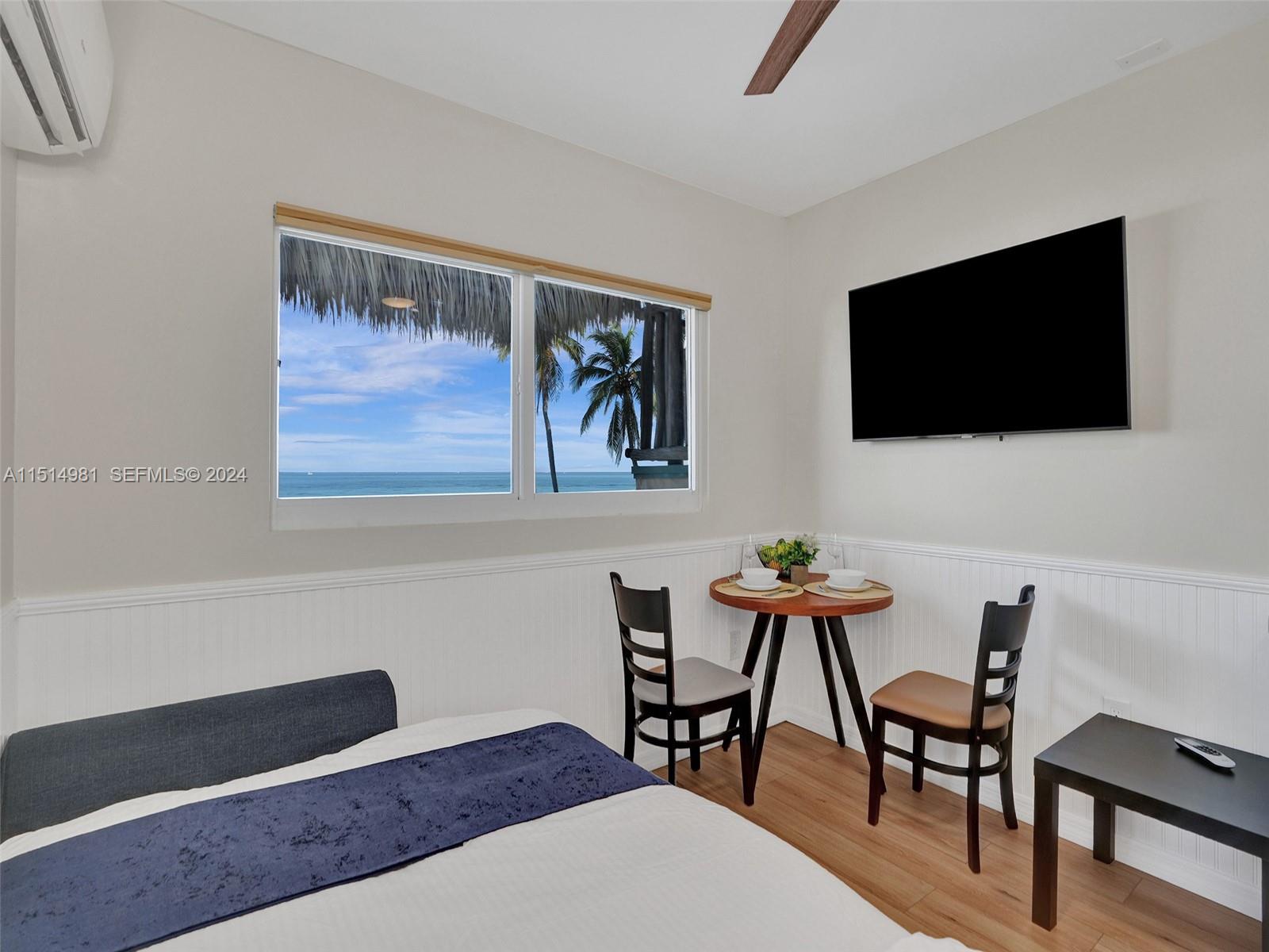 900 North Surf Road, Unit 2 Hollywood, FL 33019 - Photo 33 of 48 a view of a livingroom with furniture and a flat screen tv
