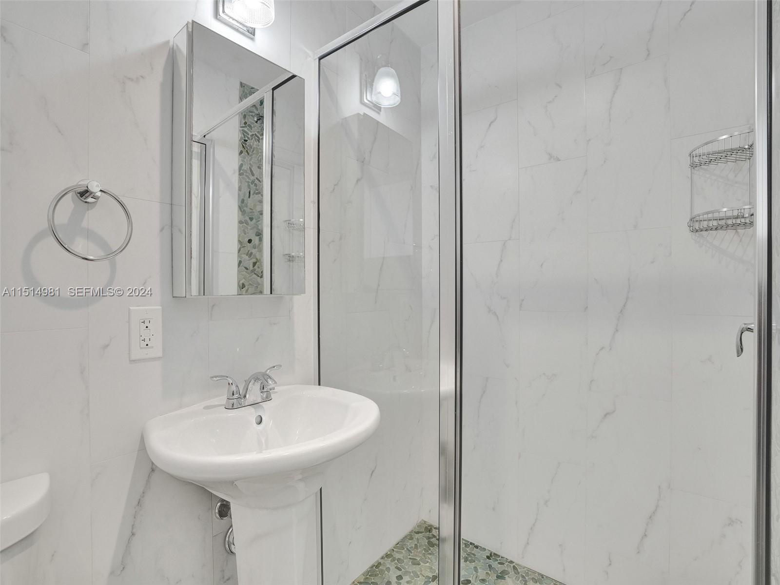 900 North Surf Road, Unit 2 Hollywood, FL 33019 - Photo 39 of 48 a bathroom with a sink toilet and shower