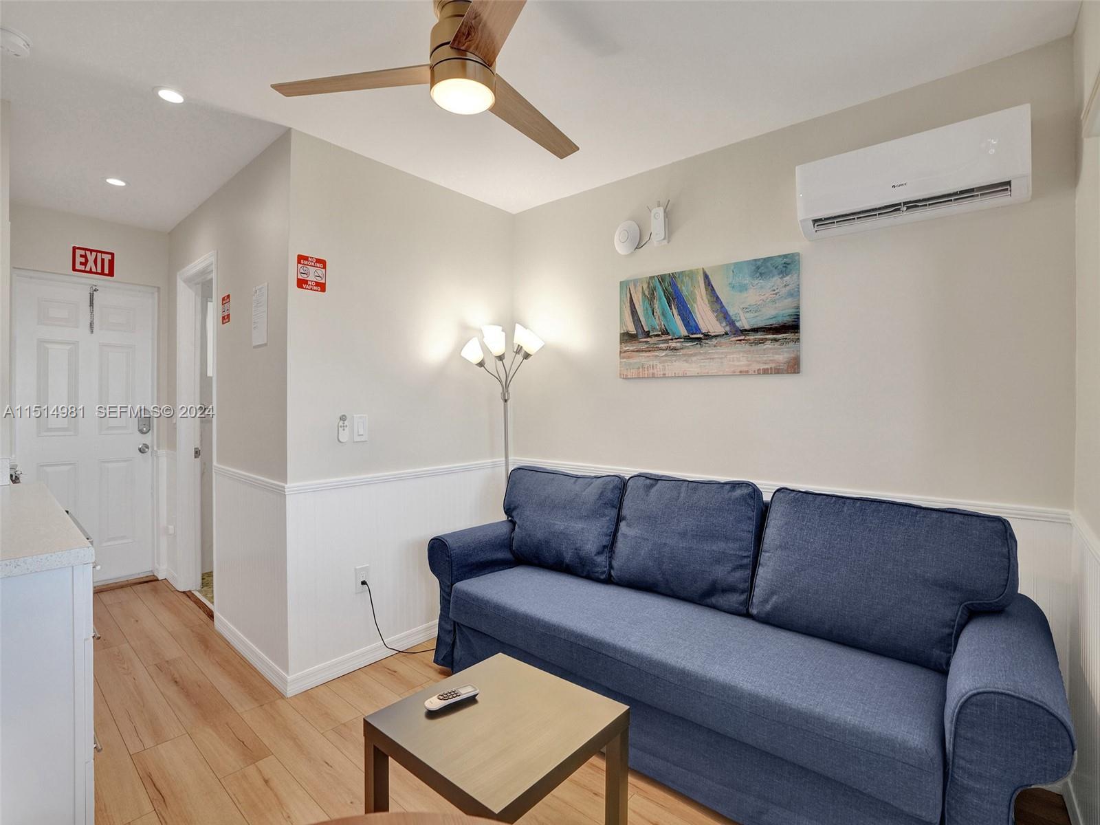 900 North Surf Road, Unit 2 Hollywood, FL 33019 - Photo 41 of 48 a living room with furniture and a ceiling fan