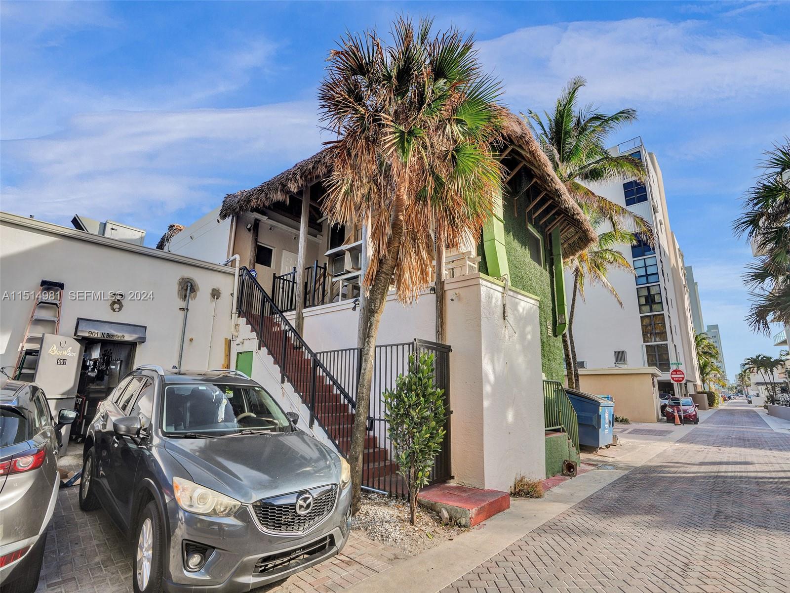 900 North Surf Road, Unit 2 Hollywood, FL 33019 - Photo 43 of 48 a couple of cars parked in front of a house
