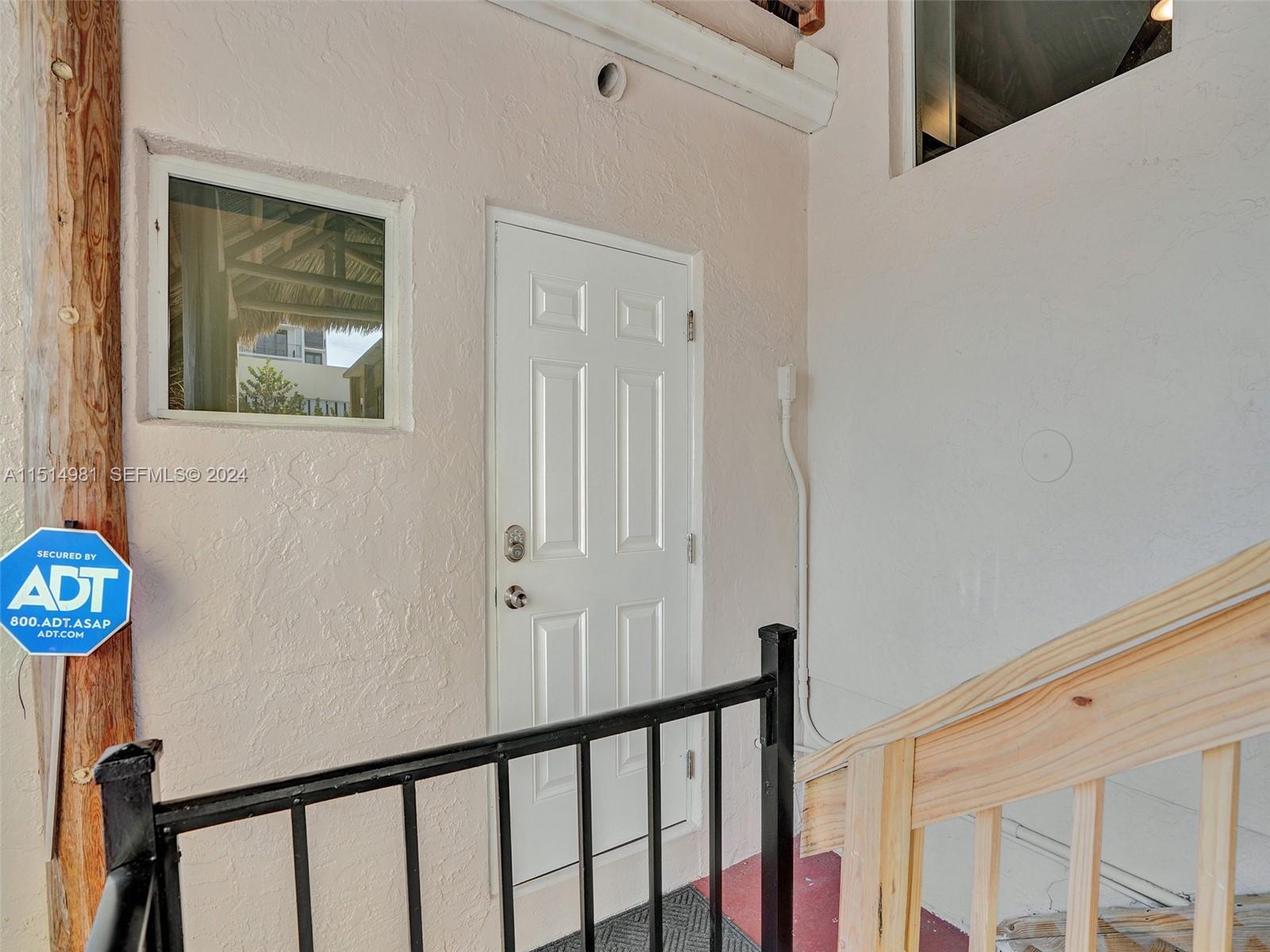 900 North Surf Road, Unit 2 Hollywood, FL 33019 - Photo 45 of 48 a view of a hallway with wooden floor