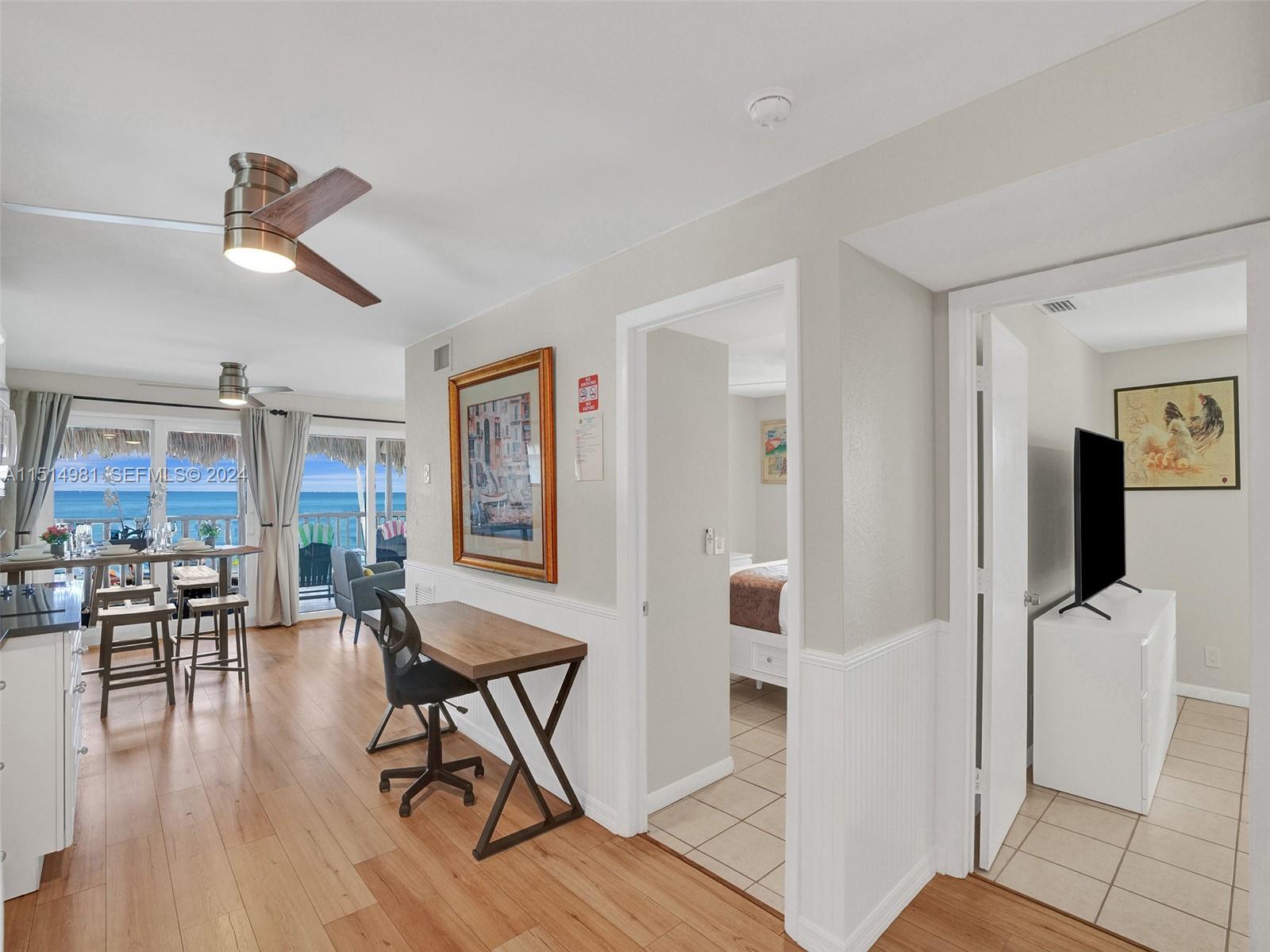 900 North Surf Road, Unit 2 Hollywood, FL 33019 - Photo 5 of 48 a view of a livingroom with furniture and hardwood floor