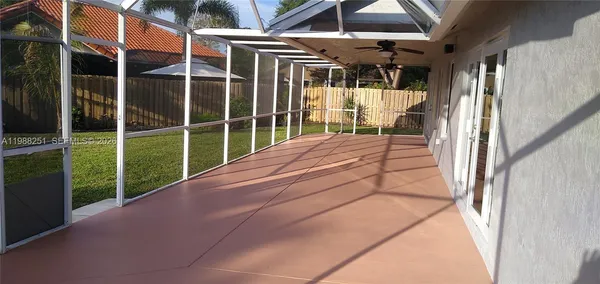 a view of a house with a yard and a garden