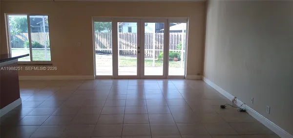 a view of an entryway with wooden floor