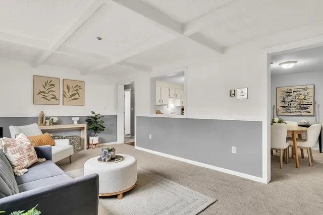 a living room with furniture and white walls