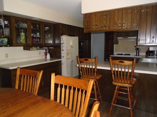 859 North 21st Road Tonica, IL 61370 - Photo 8 of 31 a kitchen with stainless steel appliances wooden floor dining table and chairs