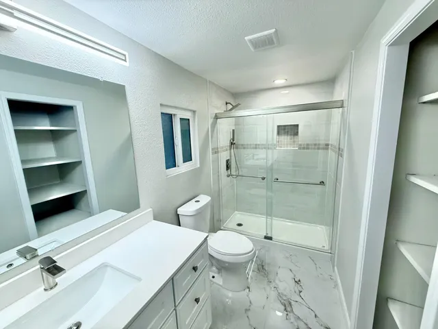 a view of a house with backyard and deck