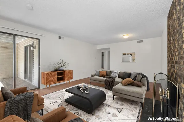 a living room with furniture and a table