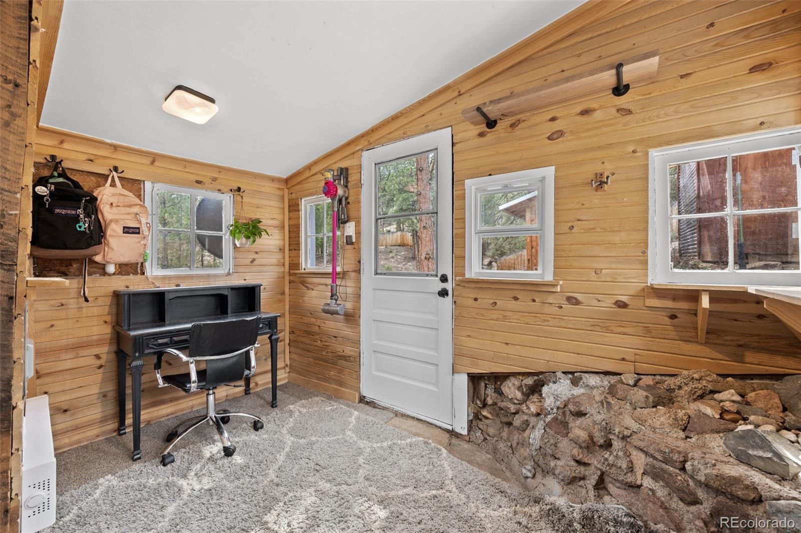 15535 South Elk Creek Road Pine, CO 80470 - Photo 21 of 25 a view of a entryway with furniture