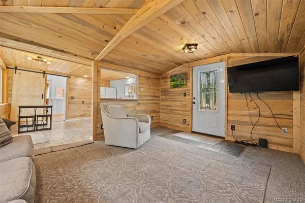 a kitchen with stainless steel appliances a stove a sink dishwasher and a refrigerator