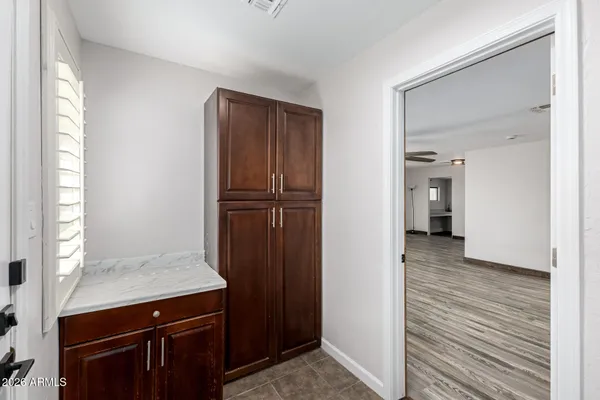 a view of hallway with wooden floor