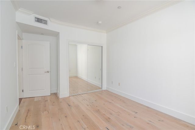 an empty room with wooden floor