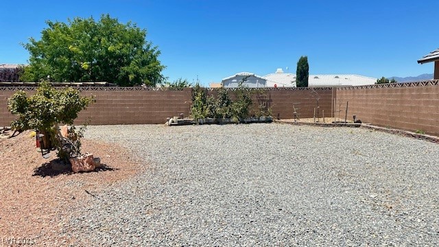 6780 Sandpebble Street Pahrump, NV 89061 - Photo 14 of 25 View of fenced backyard