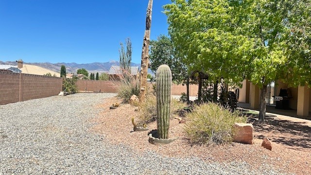 6780 Sandpebble Street Pahrump, NV 89061 - Photo 19 of 25 Fenced backyard featuring a mountain view