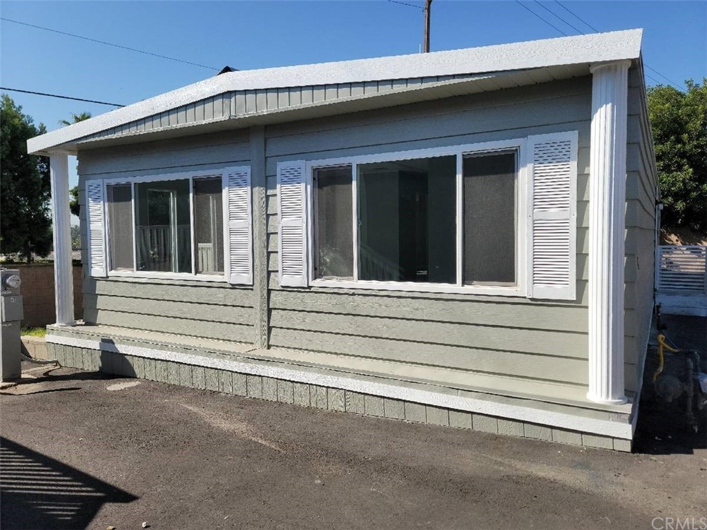 5803 Mission Riverside Ca, Unit 95 Riverside, CA 92509 - Photo 1 of 15 a side view of a house