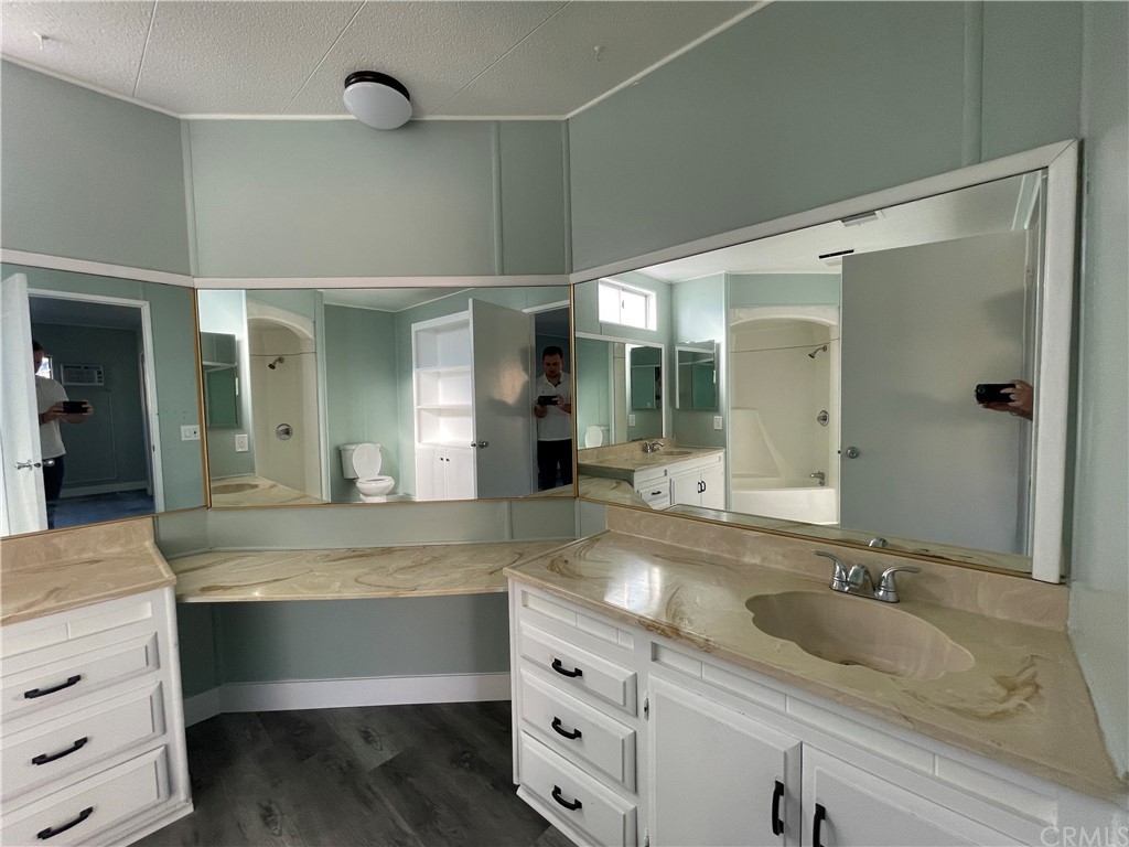 5803 Mission Riverside Ca, Unit 95 Riverside, CA 92509 - Photo 15 of 15 a bathroom with a granite countertop sink mirror and double