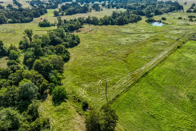 a view of a yard with an outdoor seating