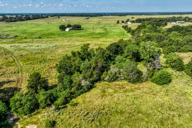 a view of a big yard with an outdoor and seating space