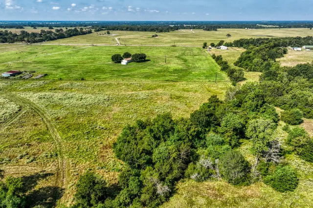 a view of a large body of water with a building in the background