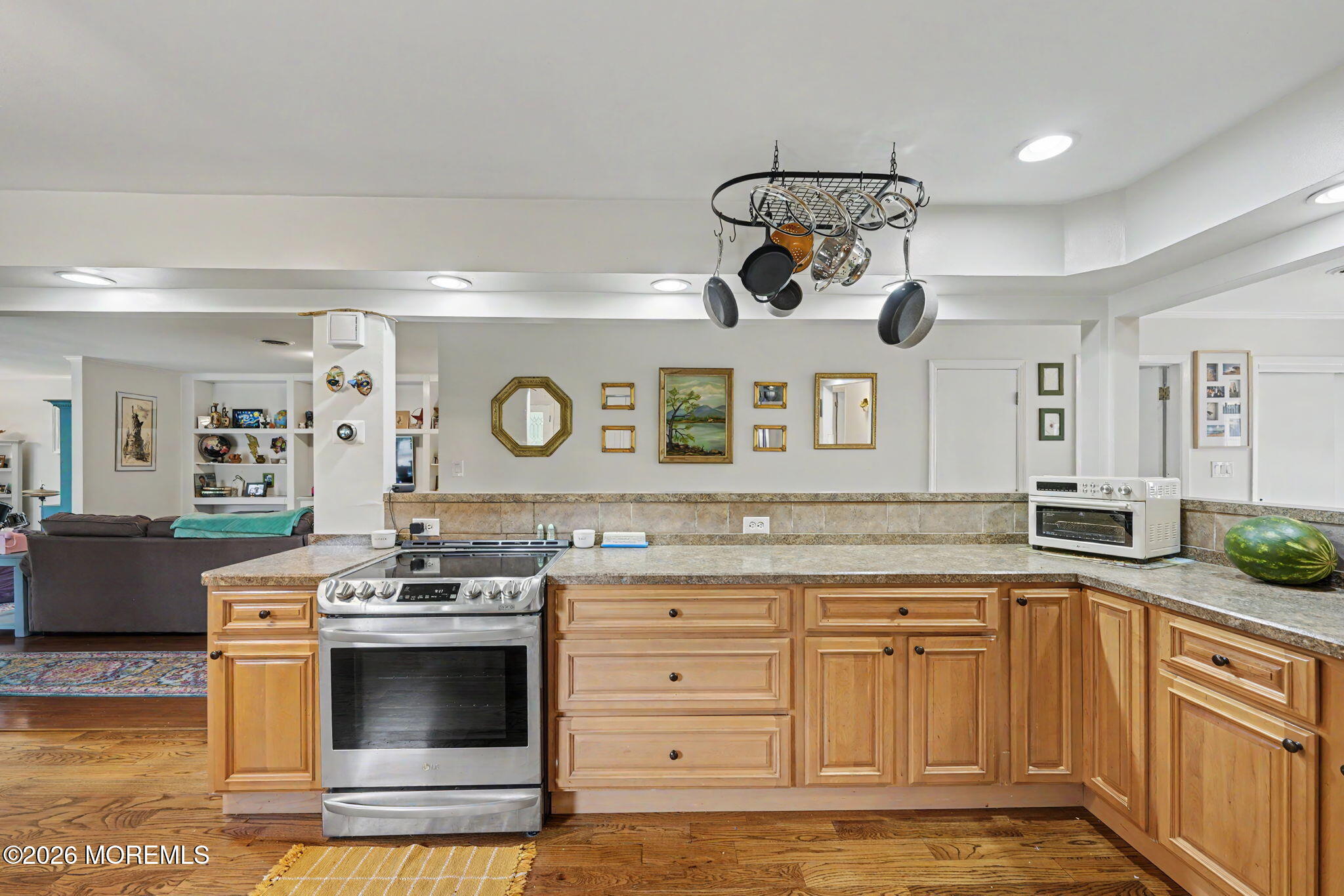 699 Aldrich Road Howell, NJ 07731 - Photo 7 of 30 a kitchen with stainless steel appliances granite countertop a stove and cabinets