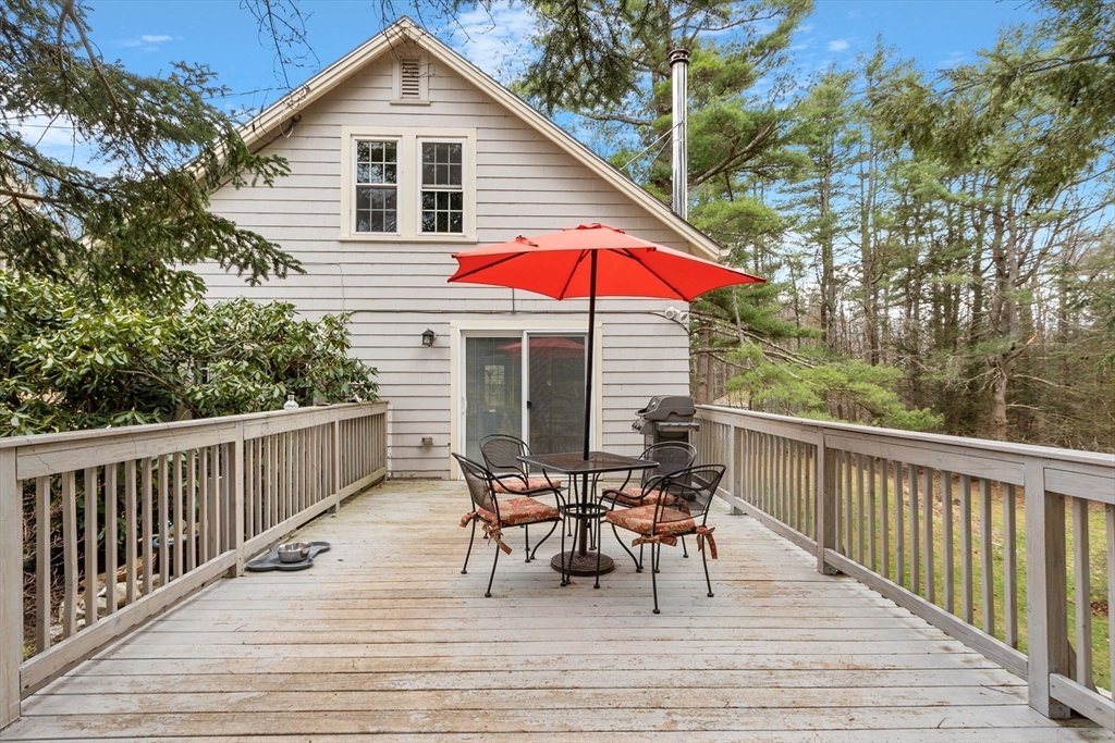 613 Petersham Road Athol, MA 01331 - Photo 13 of 41 a view of a house with wooden deck and furniture