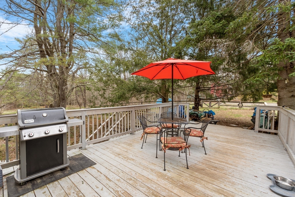 613 Petersham Road Athol, MA 01331 - Photo 14 of 41 a view of a deck with furniture and barbeque grill