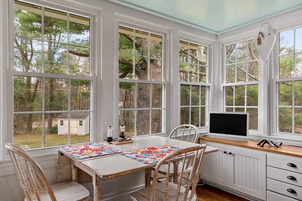 613 Petersham Road Athol, MA 01331 - Photo 21 of 41 a open dining room with furniture a large window and table