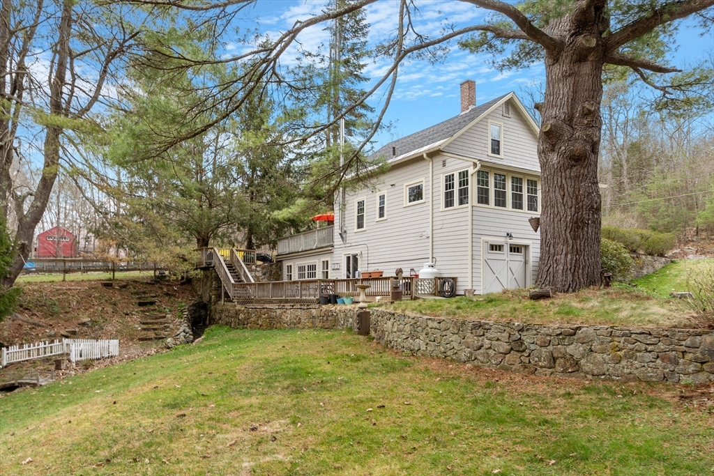 613 Petersham Road Athol, MA 01331 - Photo 5 of 41 a white house that has a tree in front of it