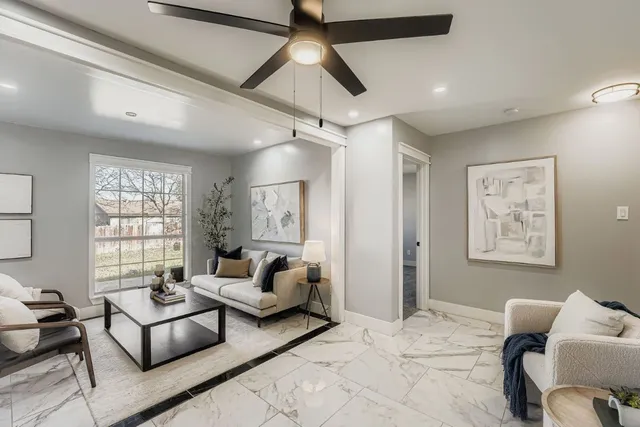 a living room with furniture and a window