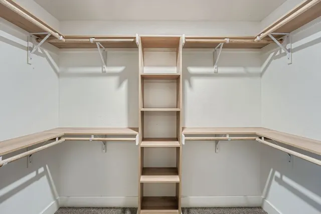 a view of an empty walk in closet