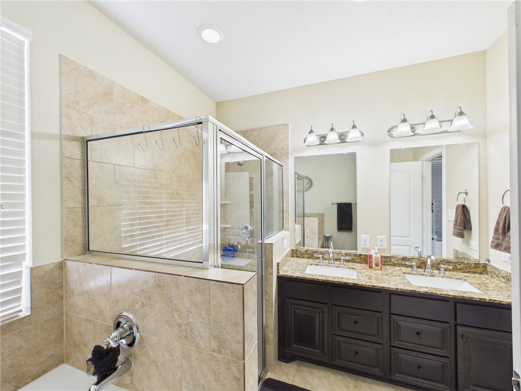 10645 C Hoppess Road Franklin, TX 77856 - Photo 25 of 50 a bathroom with a double vanity sink mirror and double