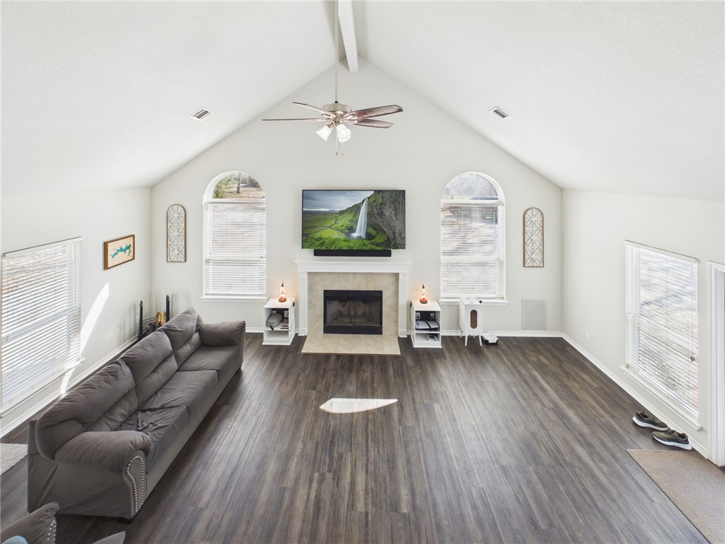 10645 C Hoppess Road Franklin, TX 77856 - Photo 26 of 50 a living room with furniture a fireplace and a flat screen tv