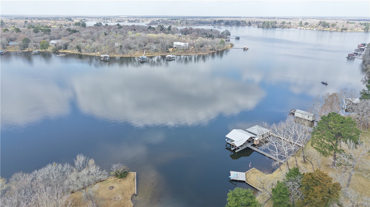 10645 C Hoppess Road Franklin, TX 77856 - Photo 3 of 50 an aerial view of a house with outdoor space and lake view
