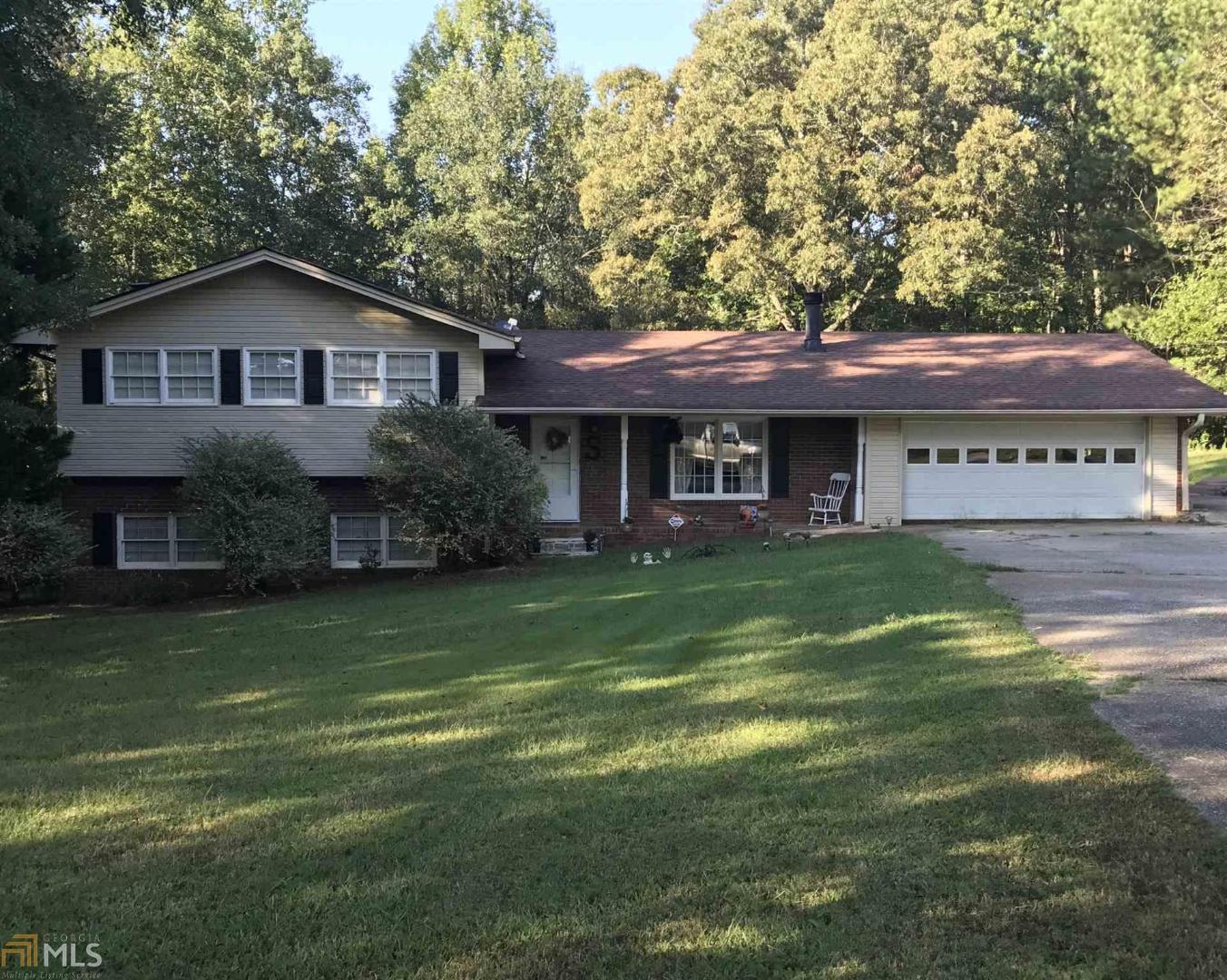 8604 Banks Mill Road Winston, GA 30187 - Photo 1 of 1 a front view of a house with garden