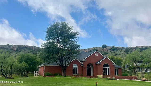 a view of swimming pool with a yard