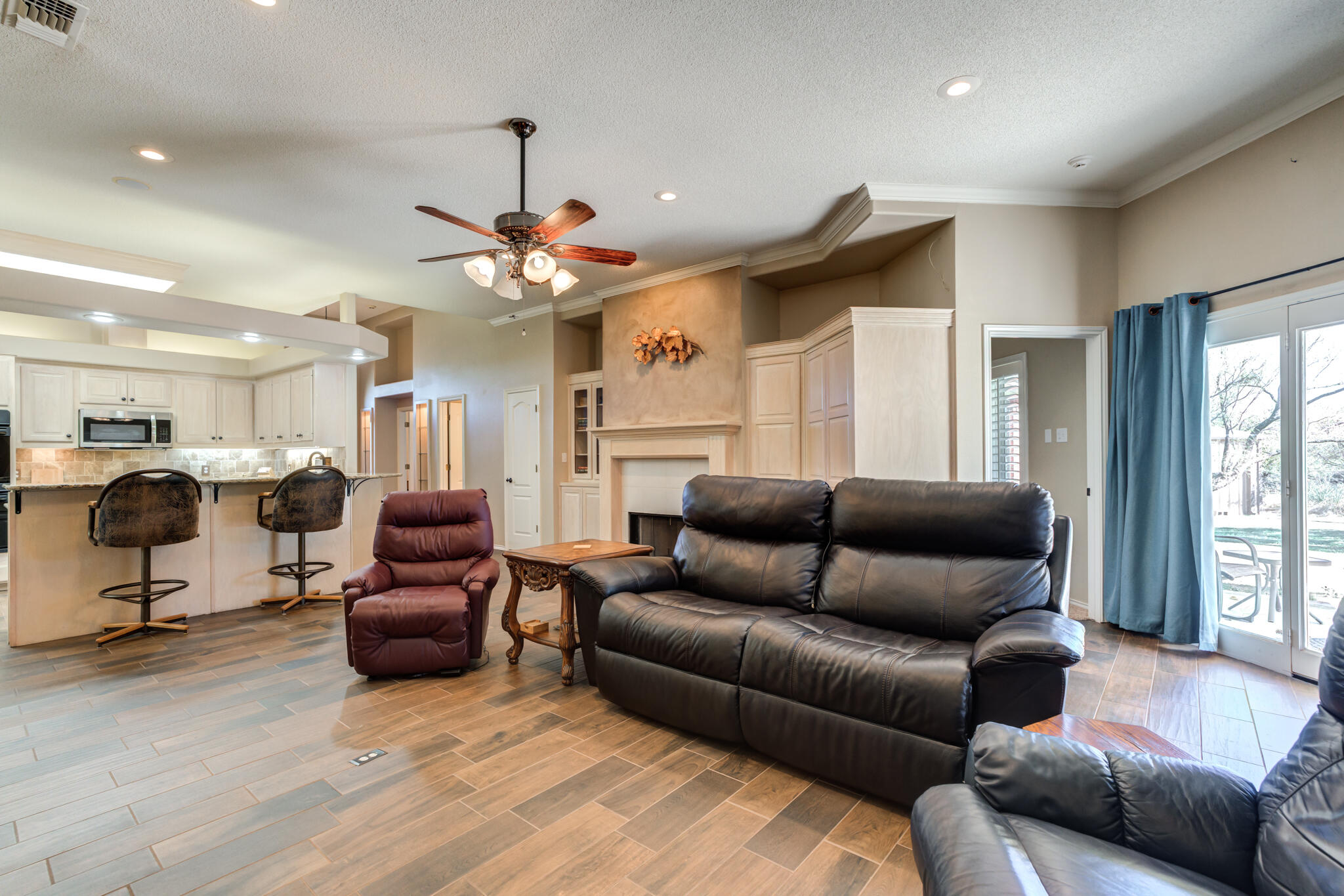 1 Squaw Lane Ransom Canyon, TX 79366 - Photo 18 of 74 a living room with furniture and a chandelier