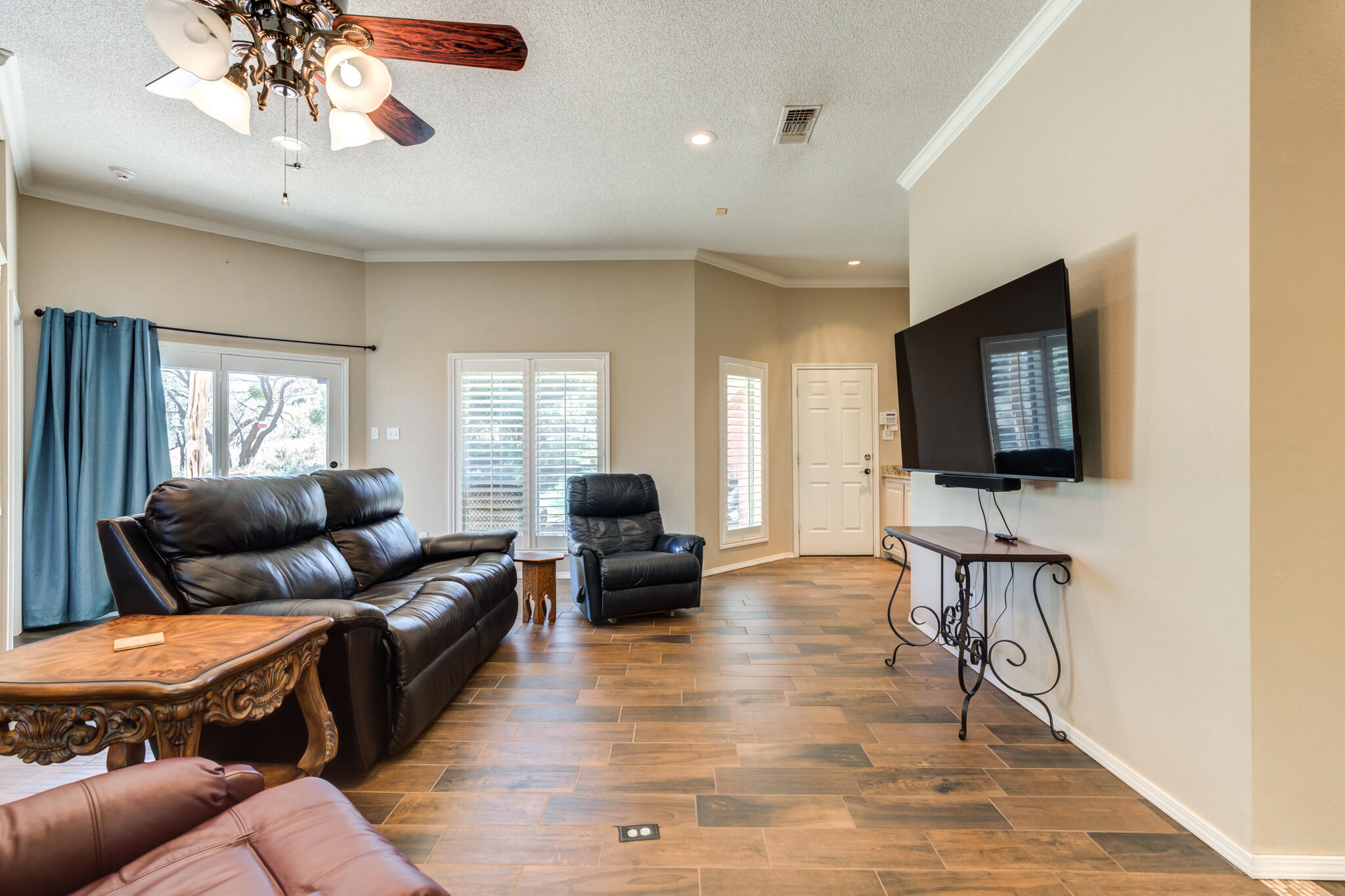 1 Squaw Lane Ransom Canyon, TX 79366 - Photo 21 of 74 a living room with furniture and a flat screen tv