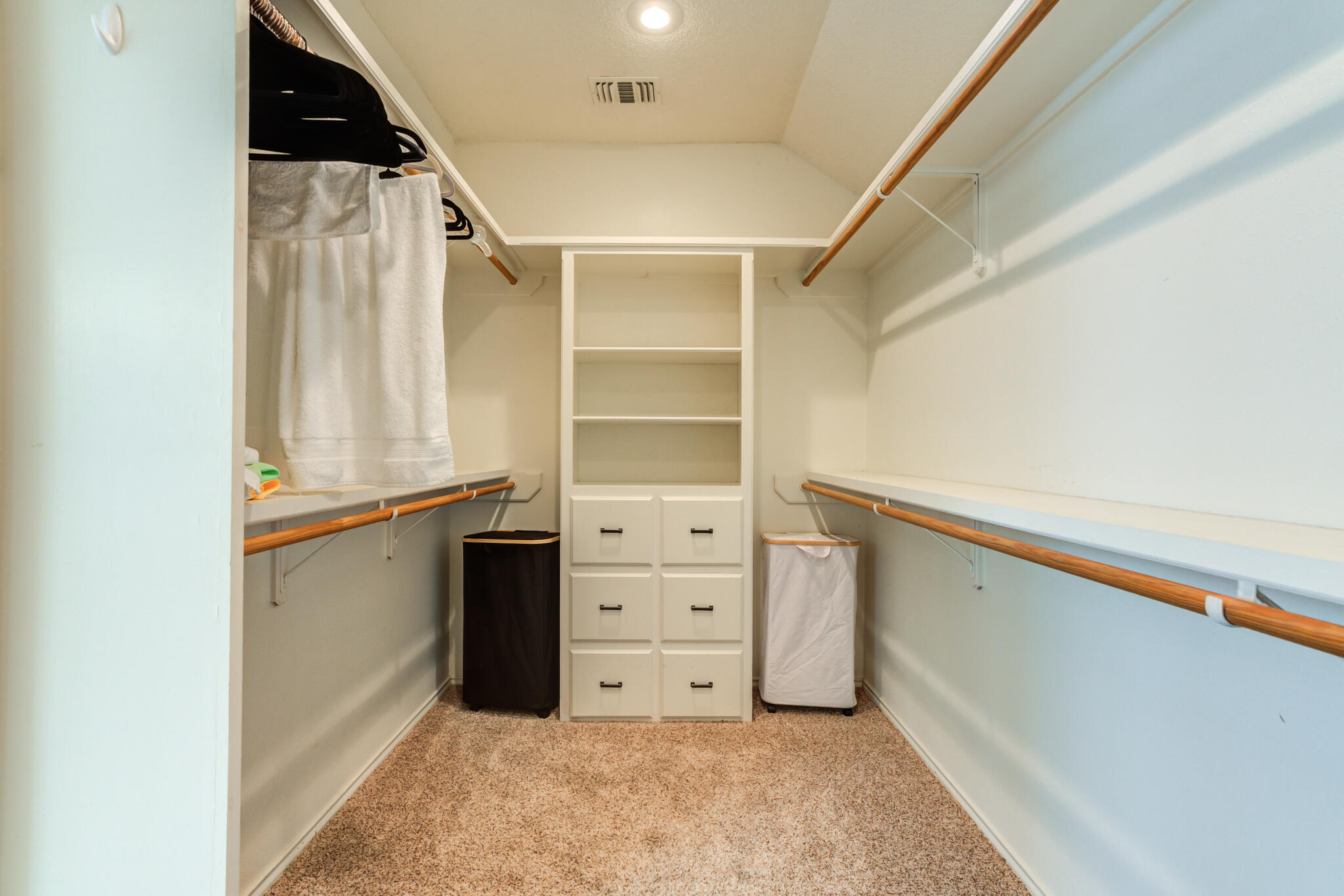1 Squaw Lane Ransom Canyon, TX 79366 - Photo 42 of 74 a view of walk in closet with empty racks