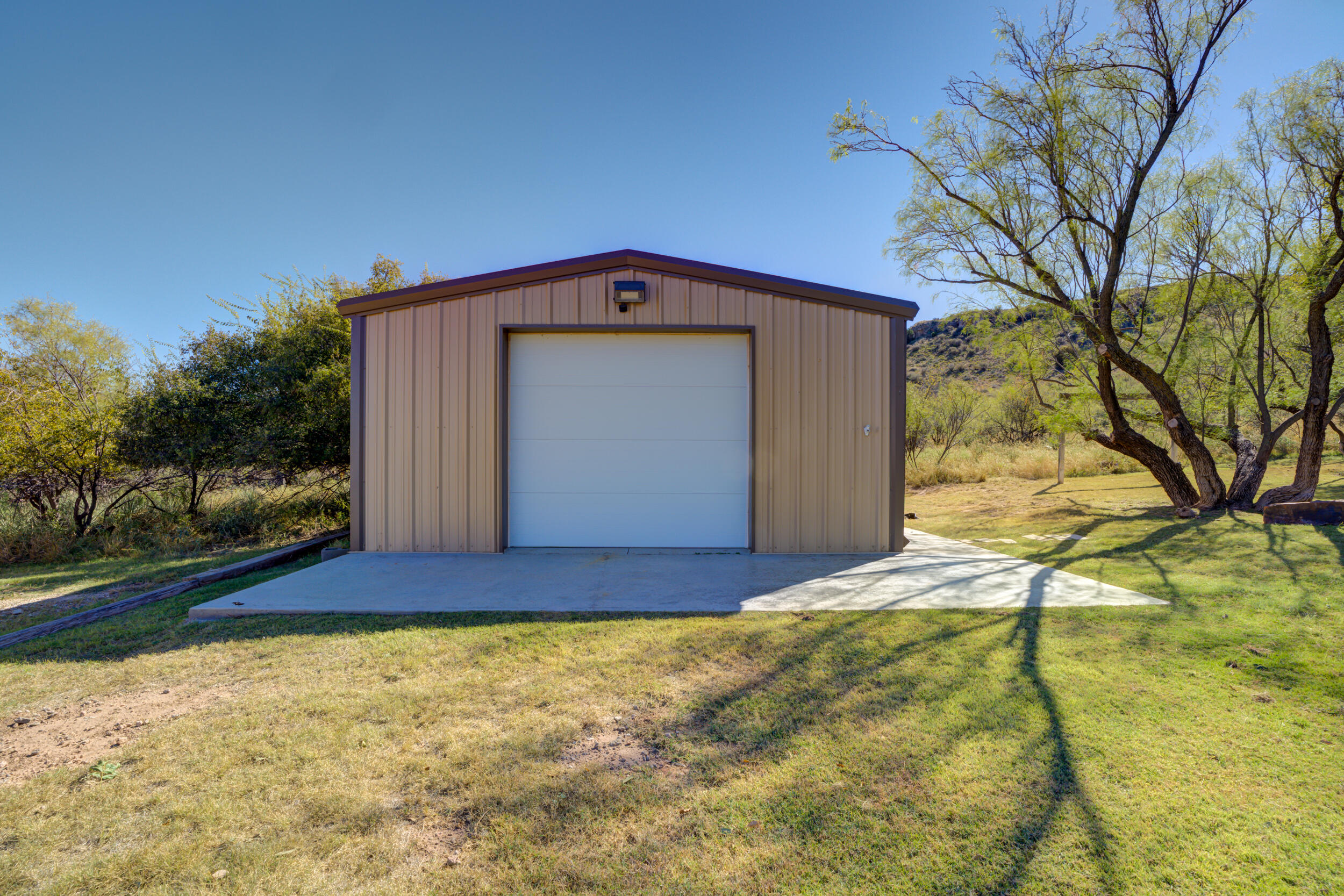1 Squaw Lane Ransom Canyon, TX 79366 - Photo 58 of 74 a front view of a house with a yard